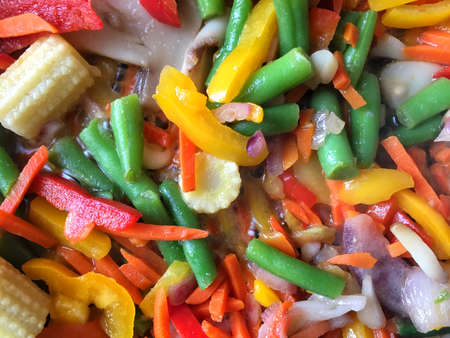 Fresh sliced vegetables are stewed in saucepanの写真素材