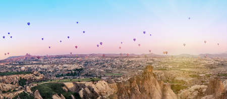 Multicolored balloons over the valley of Goreme at dawn. Cappadocia, Turkey.の写真素材