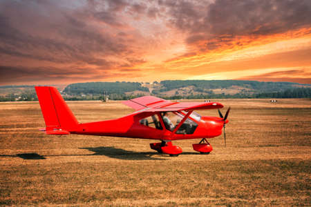Red airplane at the airportの写真素材
