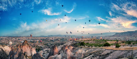 Balloons in the cloudy sky over Cappadociaの写真素材