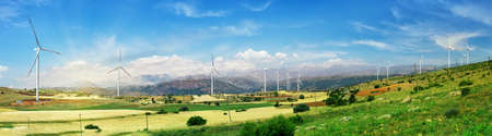 Wind farm. Wind turbine generators stand in a row on a green field. Panorama. Clean alternative energy concept. Turkeyの写真素材