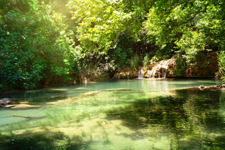 Kursunlu Nature Park and waterfall with the lake. Bright greenery, turquoise lake water. Summer landscape. Antalya, Turkeyの写真素材