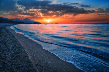 Sea or ocean bay at the sunsetの写真素材