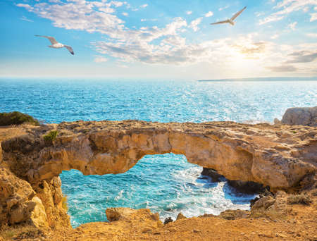 Famous Lovers Bridge or Raven Arch with seagulls in the skyの写真素材