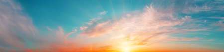 Sunrise sky panorama with bright sunの写真素材