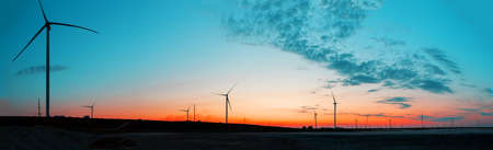 Panorama of wind farm at sunriseの写真素材