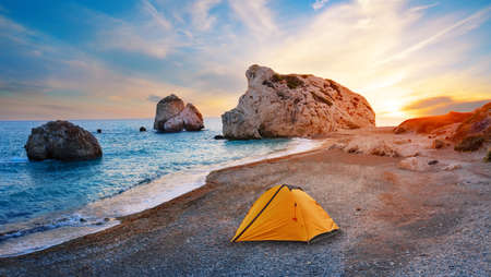 Orange tourist tent on the beach of Aphrodite in Cyprusの写真素材