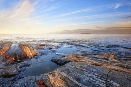 Rocky shore of northern lakeの写真素材