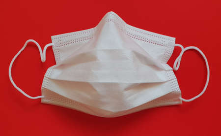 Single used white disposable protective medical mask with ear straps for face against viruses,...