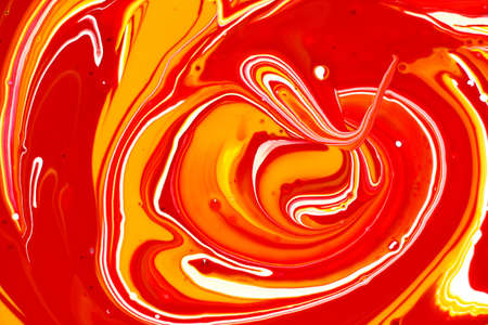 Abstraction from the mixing of paint of different colors.の写真素材