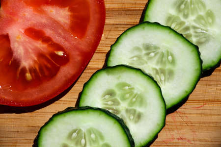 Vegetables, cucumbers and tomatoes are cut into rings.の写真素材