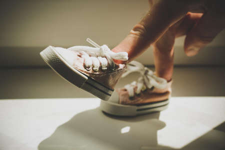 Sneakers on the fingers. In the state of walking.の写真素材