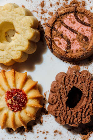 A set of different cookies with chocolate, jam and delicious filling of confiture, sprinkled with...