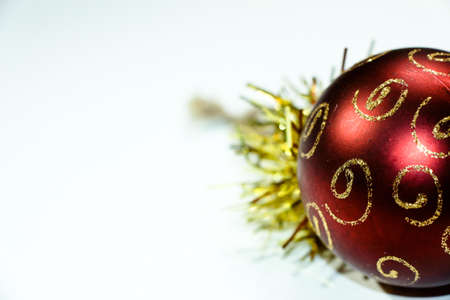 Beautiful Christmas ball for decorating a Christmas tree with a red shade on a white backgroundの写真素材