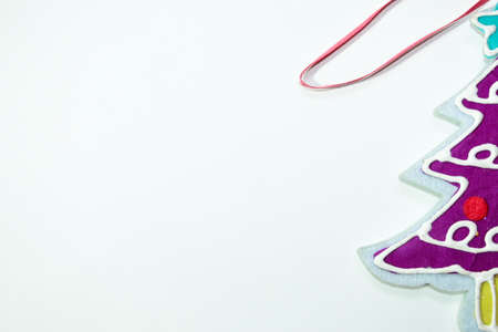 Colorful toy for decoration of a decorated Christmas tree with a five-pointed star on a white backgroundの写真素材