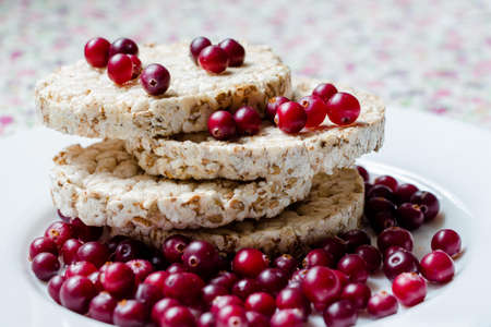 Isolated on a white background, fresh cranberries. Healthy and vitaminized food for a person.の写真素材