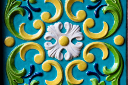 Different shapes and colorful pattern on the wall. The pattern is very old and belongs to the architecture of the seventeenth century. The pattern attracts attention with its beauty.の写真素材
