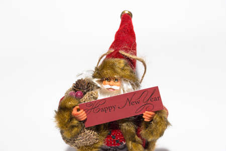 Santa Claus or Santa Claus is standing on a white background and holding a letterhead - Happy New...