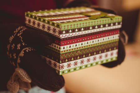 In warm hands. Christmas box.の写真素材