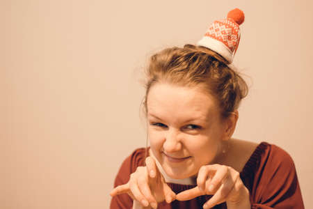 She is wearing a red sweater. Bunny girl's head is tied with hair patternsの写真素材