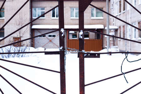 Metal gates that are locked and chain. This territory is forbidden for visitors.