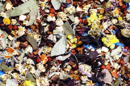 Herbal tea from berries and flowers. Very tasty and healthy brewing drink. Tea on a neutral background in blue.の写真素材