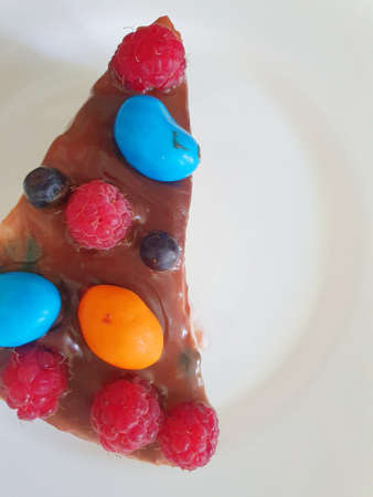 Delicious piece of chocolate cake. The cake is baked for birthday and presented with love.の写真素材