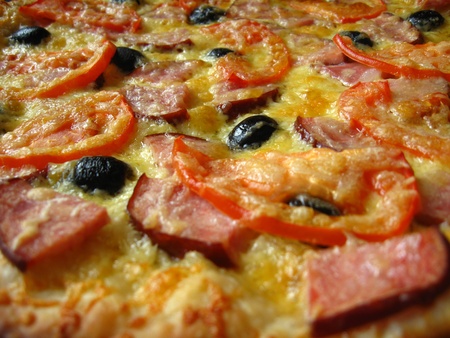 The image of tasty pizza with an appetizing stuffingの写真素材