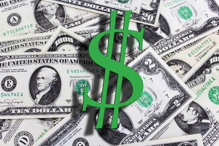 The green letter S on a background of dollar banknotes