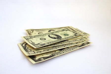 Some dollar banknotes isolated on a white background