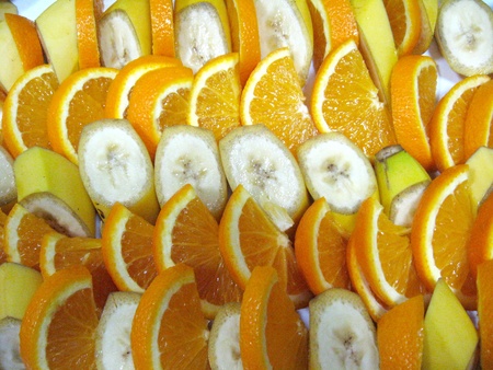 The image of background from the cut fruit of bananas and orangesの写真素材