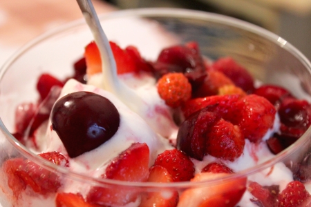 tasty icecream with berries of cherry and wild strawberryの写真素材