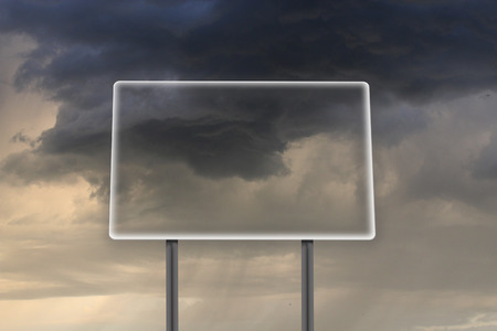 empty and transparent billboard in thunder-storm with dark cloudsの写真素材