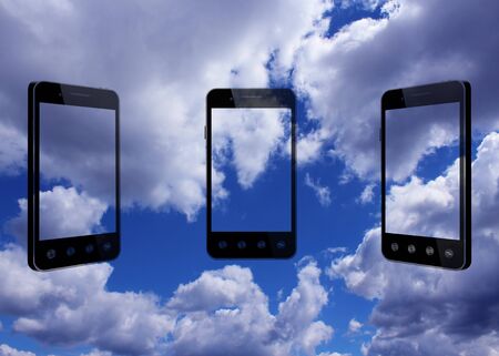 smart-phones transparent on the blue beautiful sky backgroundの写真素材