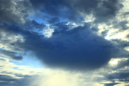 cloud with unusual shape and sunny beams