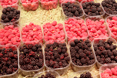 ripe berries of blackberry and raspberry in the shop
