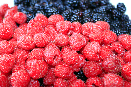 heap of ripe berries of raspberry and blackberry