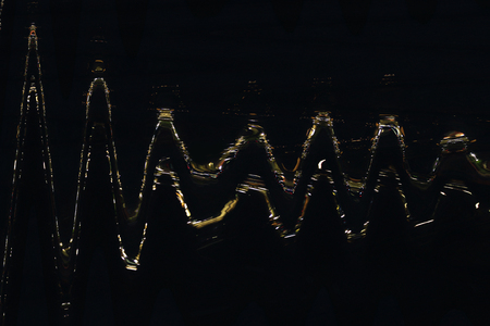 golden abstract pattern on the black background