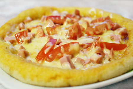 round tasty pizza with an appetizing stuffingの写真素材