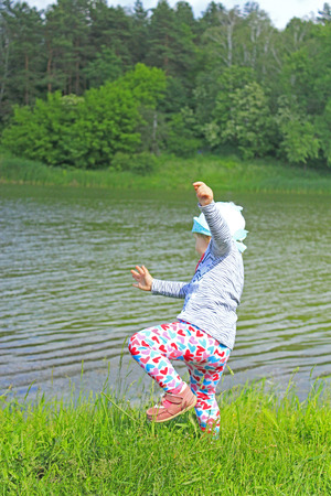 baby falls down to the river at the forestの写真素材
