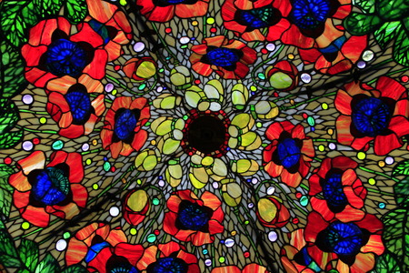 stained-glass window from multicolored glasses like red poppies flowersの写真素材