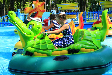 a girl rides on electric catamaran in the city park of Kharkivのeditorial素材