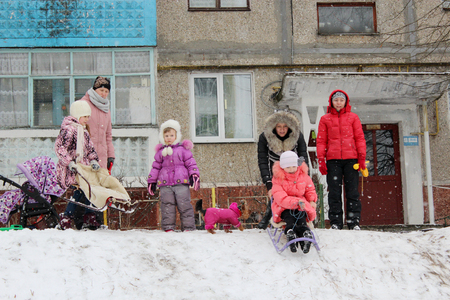 town and joy children are sleding from the hillのeditorial素材