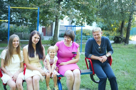 Funny relatives at the party have fun and indulge in a swing. Happy people enjoy lifeのeditorial素材