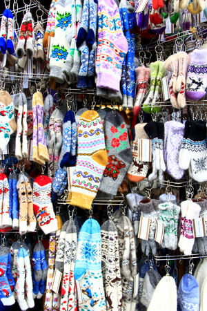 Woolen mittens and socks. Rich choice of winter goods in market of Yaremche. Assortment of warm clothes. Woolen goods. Warm winter clothesのeditorial素材