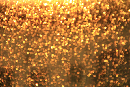 Golden bokeh. Texture with gold abstraction. Creative abstract golden patterned background. A lot of...