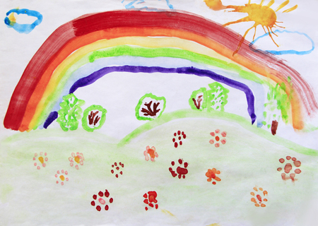 Childs drawing of clearing with flowers rainbow and colored bushes. Bright summer. Childish art. Artwork drawn by watercolors. Childrens drawing water color paints on paperの写真素材