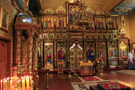 Beautiful iconostasis with ancient icons set in golden frames. Religious work of art in church. Inside Slavonic churchのeditorial素材