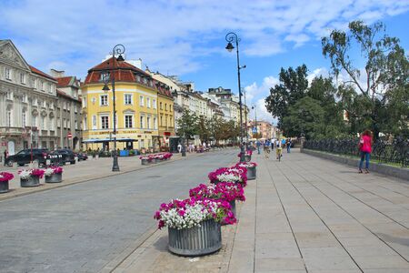 Nature in modern city. Flowers in city street decoration. Beautiful flower beds in city. Urban nature in Warsaw. Floral decoration on city streetのeditorial素材