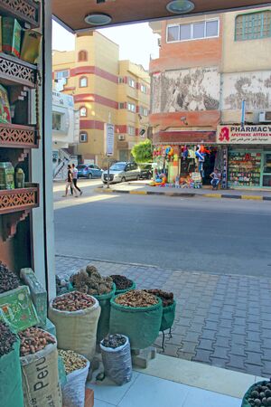 Dried fruits are sold in Hurghada store. Spices and dried fruits are visible through the window of private store. Oriental spices and seasonings in bags and parcels are sold at marketのeditorial素材